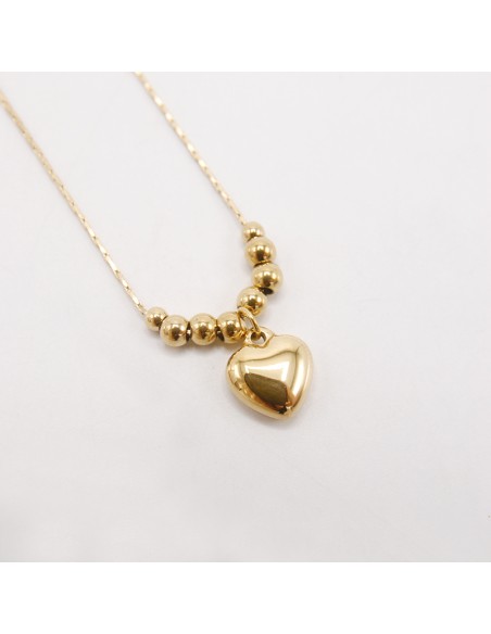 Collana in acciaio con cuore e granelli oro